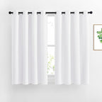 NICETOWN 50% Blackout White Curtain Set, Modern Design Solid Grommet Draperies/Drapes for Basement & Nursery Room (2 Panels, 52 inches Wide, 45 inches Long)